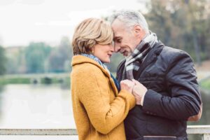 Happy couple overcoming their experiences with trauma and hearing loss