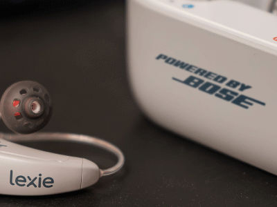 Lexie B2 Plus hearing aids with one hearing aid next to the case